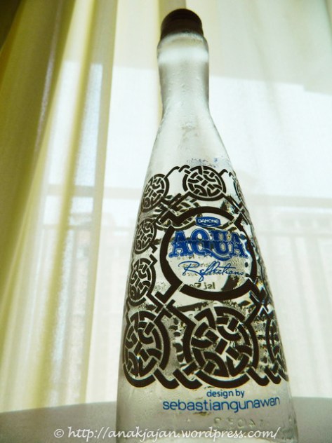 Aqua glass bottle by Sebastian Gunawan