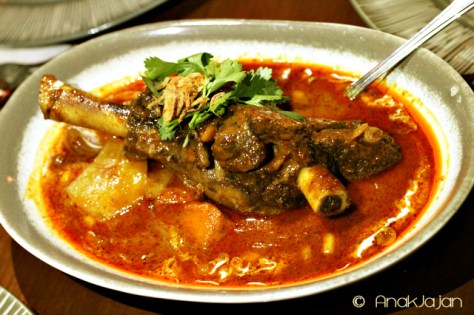 Massaman Curry of slow-braised Lamb Shank with Cardamom, shallots, pumkins and thamrind