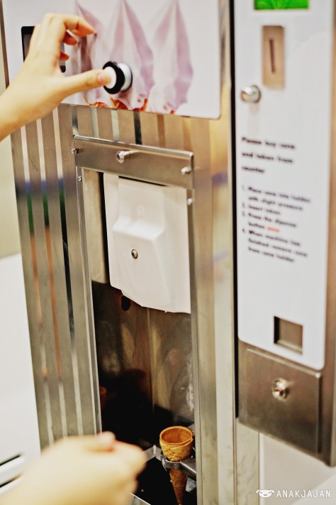 2. Put the cone and token into the machine