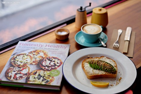 Avocado on sourdough with housemade labneh, dukka and lemon AUD 10, Flat white AUD 4